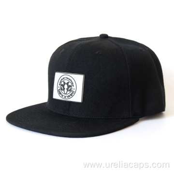 Woolen snapback cap with rubber logo